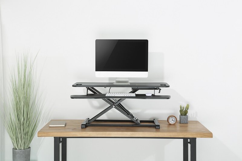 Updesk Cross Gasfeder erh&ouml;hung | Bei der Arbeit fit bleiben | Worktrainer.de